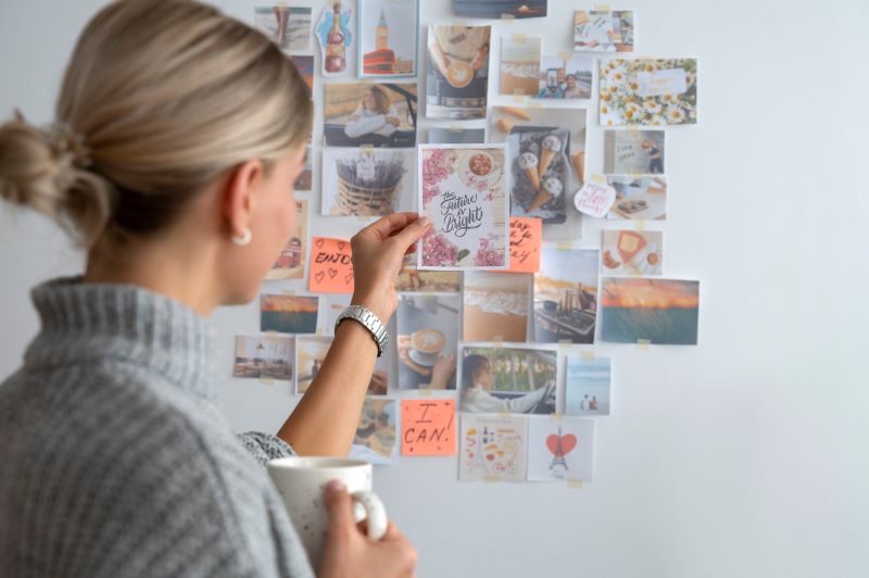 A person visualizing their career goals on a vision board